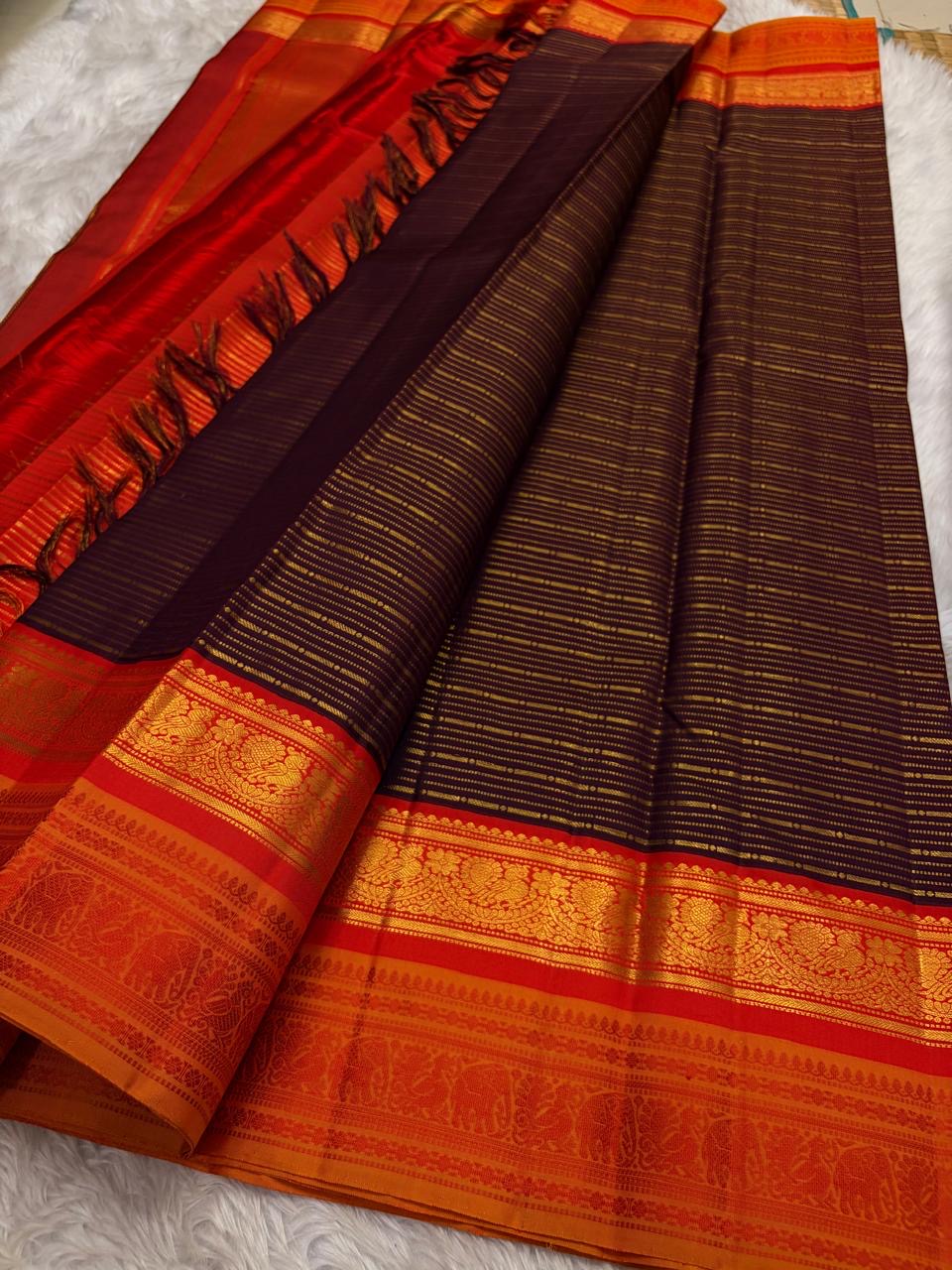 Kanjeevaram pure silk saree in burnt copper with contrast pallu and traditional zari finish