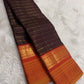 Kanjivaram butta saree in burnt copper with double layered zari and silk thread border