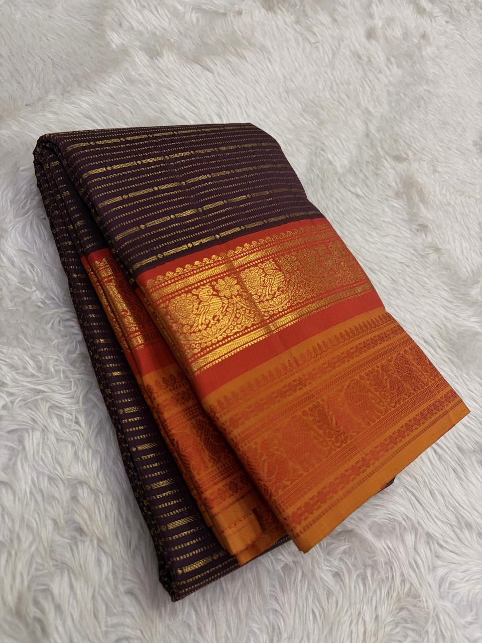 Burnt copper handwoven pure silk Kanchipuram butta saree with horizontal zari stripes