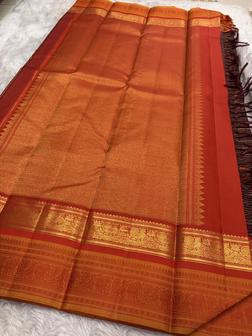 Kancheepuram handwoven butta saree in burnt copper, woven for Idam Living in Kunnam village