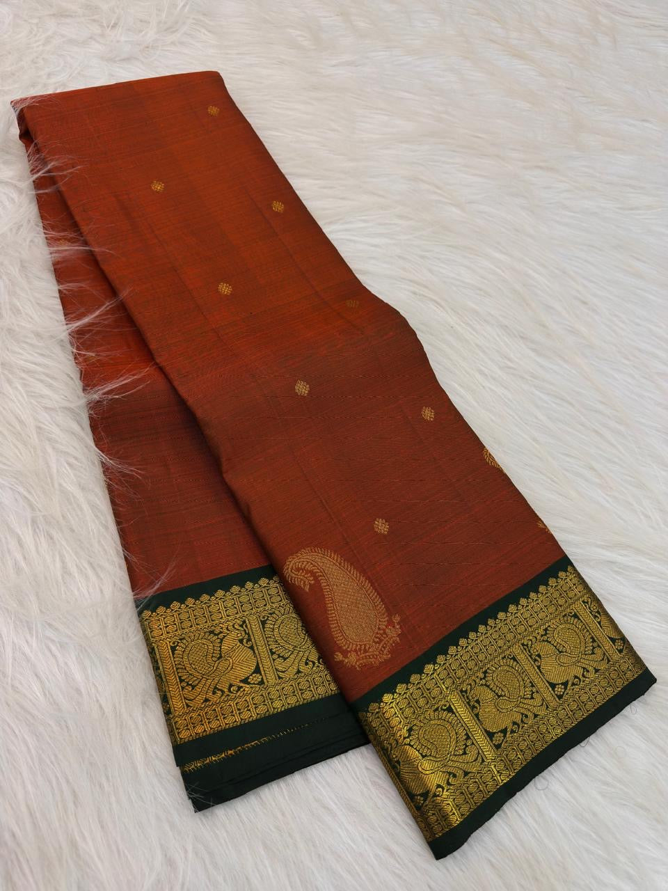 Burnt Orange and Forest Green handwoven pure silk Kanchipuram Butta saree by Idam Living
