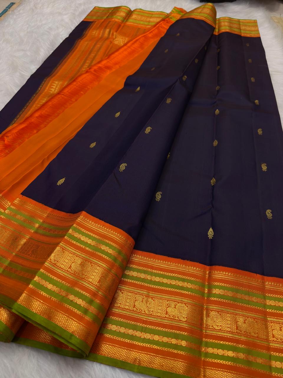 Handwoven Deep Purple pure silk Varisaipet saree with traditional gold zari motifs.