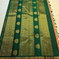 Close view of antique gold Gandaberunda motif on Burnt Orange Kanjivaram silk