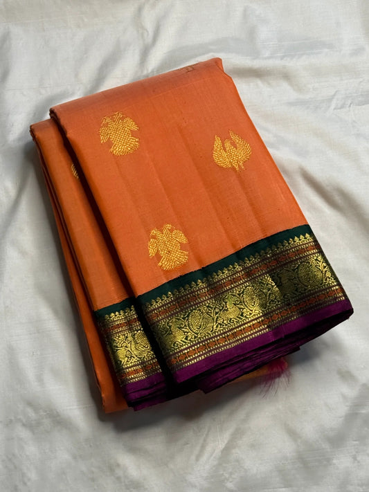 Burnt Orange Handwoven Pure Silk Kanjivaram Butta saree with Gandaberunda zari motifs