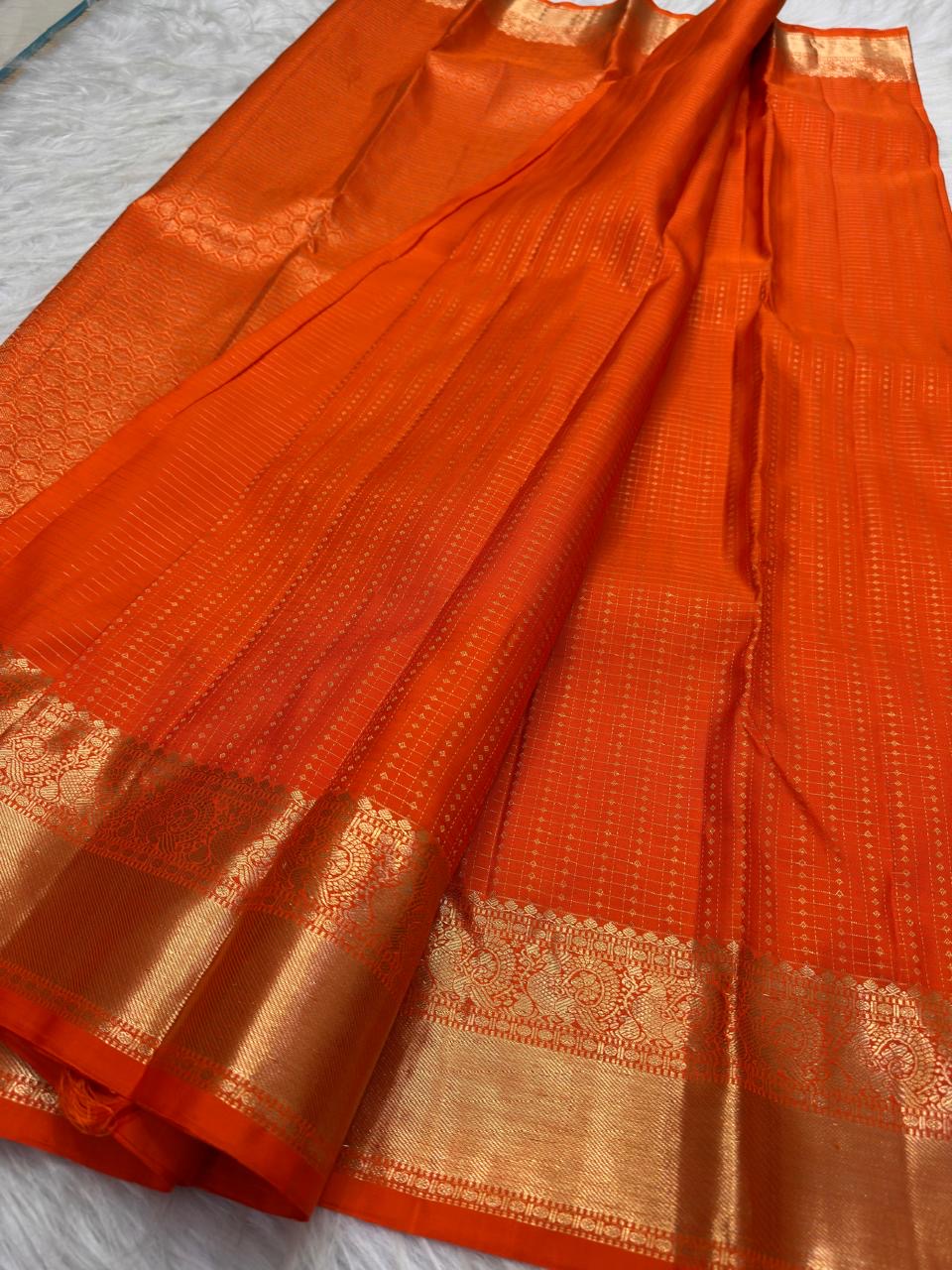 Burnt Orange pure silk Kanjivaram saree with fine antique-gold woven pattern.
