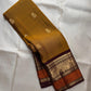 Golden Turmeric pure silk Kanchipuram saree, Butta weave with Deep Aubergine border — full drape view