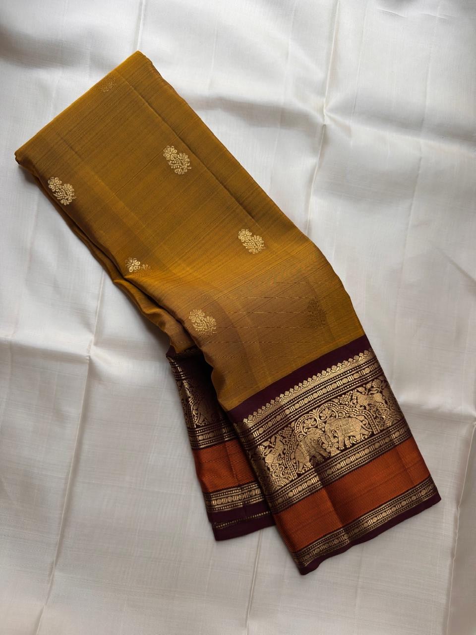 Golden Turmeric pure silk Kanchipuram saree, Butta weave with Deep Aubergine border — full drape view