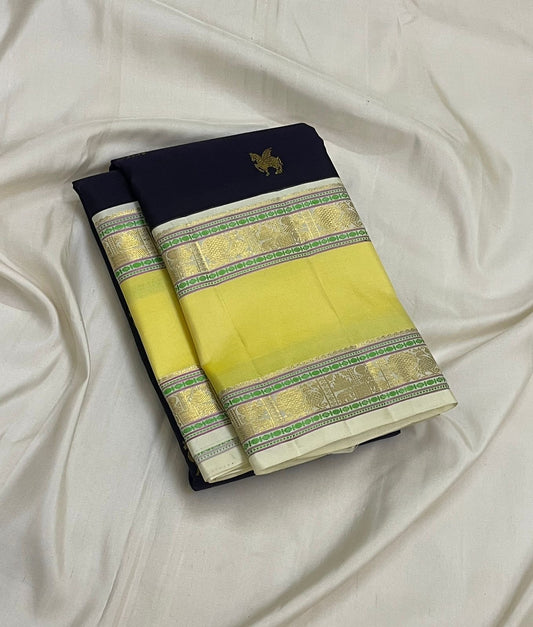 butter yellow kanjivaram saree with traditional zari and deer motifs detail view