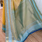 Close view of gold-toned pallu area with sky blue edge and zari woven border, available in the USA