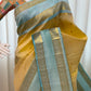 Mannequin drape of butter yellow Pure Kanchipuram silk saree with sky blue border and zari woven panels, shipped from New Jersey USA