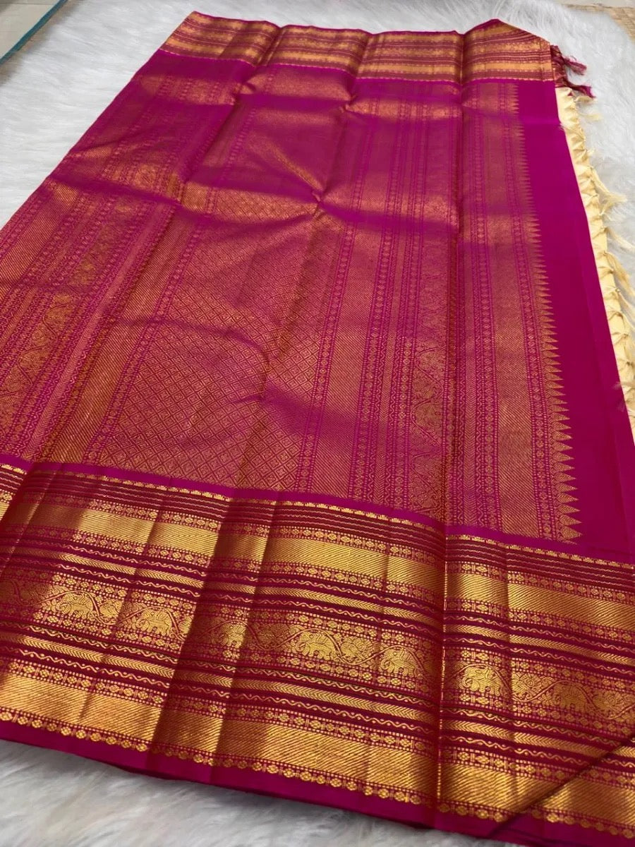 Handwoven Pure Silk Kanchipuram saree in warm ivory raspberry pink and antique gold