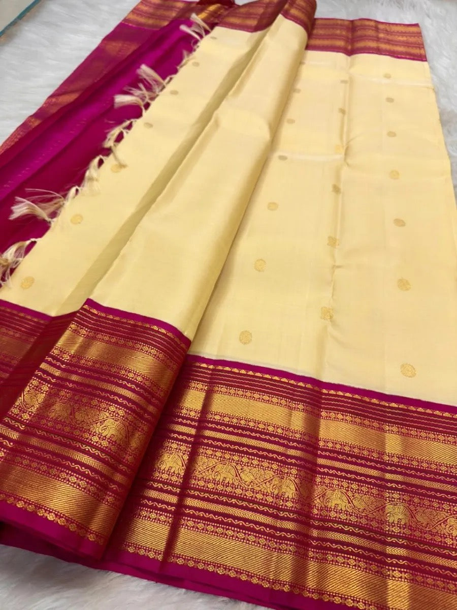Buttercream ivory Pure Silk Korvai Kanchipuram saree with Bougainvillea pink border and petite gold zari buttas