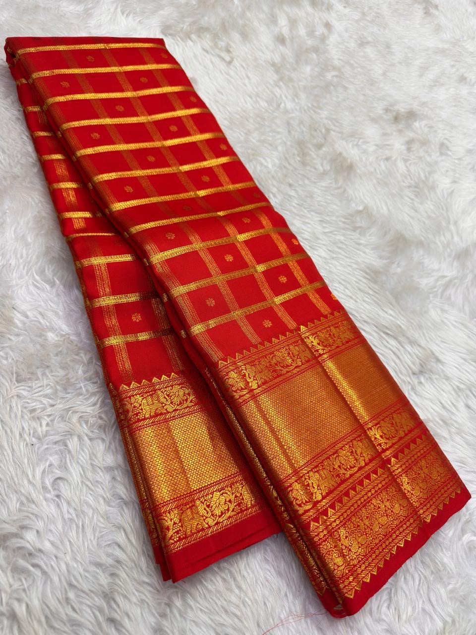 Vermilion Red Gold Checks pure silk Kanchipuram saree, silk body, showing brilliant kumkum red, warm vermilion orange highlights and glowing yellow-gold zari
