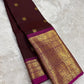 Handwoven Kanjeevaram saree featuring deep espresso brown body and vibrant rani pink border