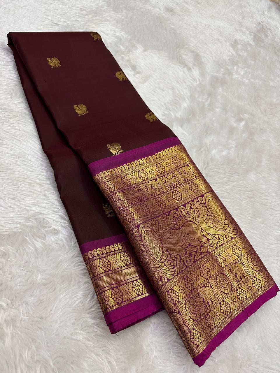 Handwoven Kanjeevaram saree featuring deep espresso brown body and vibrant rani pink border