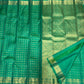 Kodi Malar floral climber pallu on a jade green Kanjeevaram silk saree