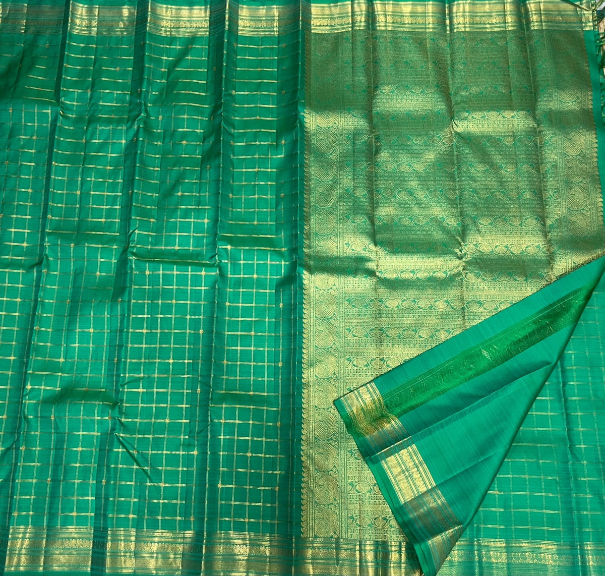 Kodi Malar floral climber pallu on a jade green Kanjeevaram silk saree