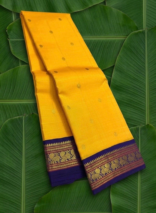 Canary yellow and violet Korvai Kanchi Pattu silk saree with Maanga butta — main product view