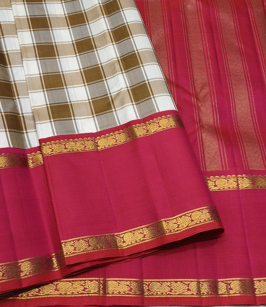 Caramel checked Kanjivaram silk saree with coral red zari border in handwoven Kanchi kattam weave