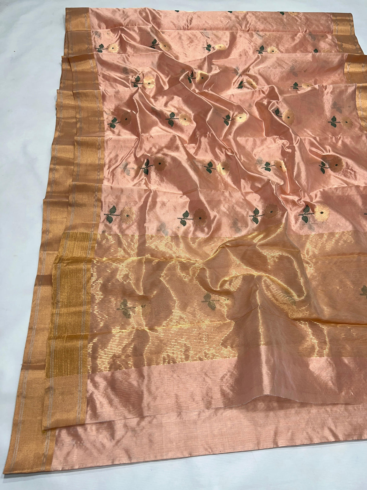 Blush Peach Chanderi saree draped, showing the floral buttas and zari pallu