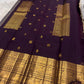 Regal Kanchipuram silk saree with deep purple body and champagne gold pallu for heirloom celebrations