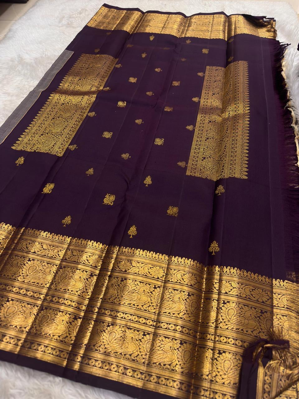 Regal Kanchipuram silk saree with deep purple body and champagne gold pallu for heirloom celebrations