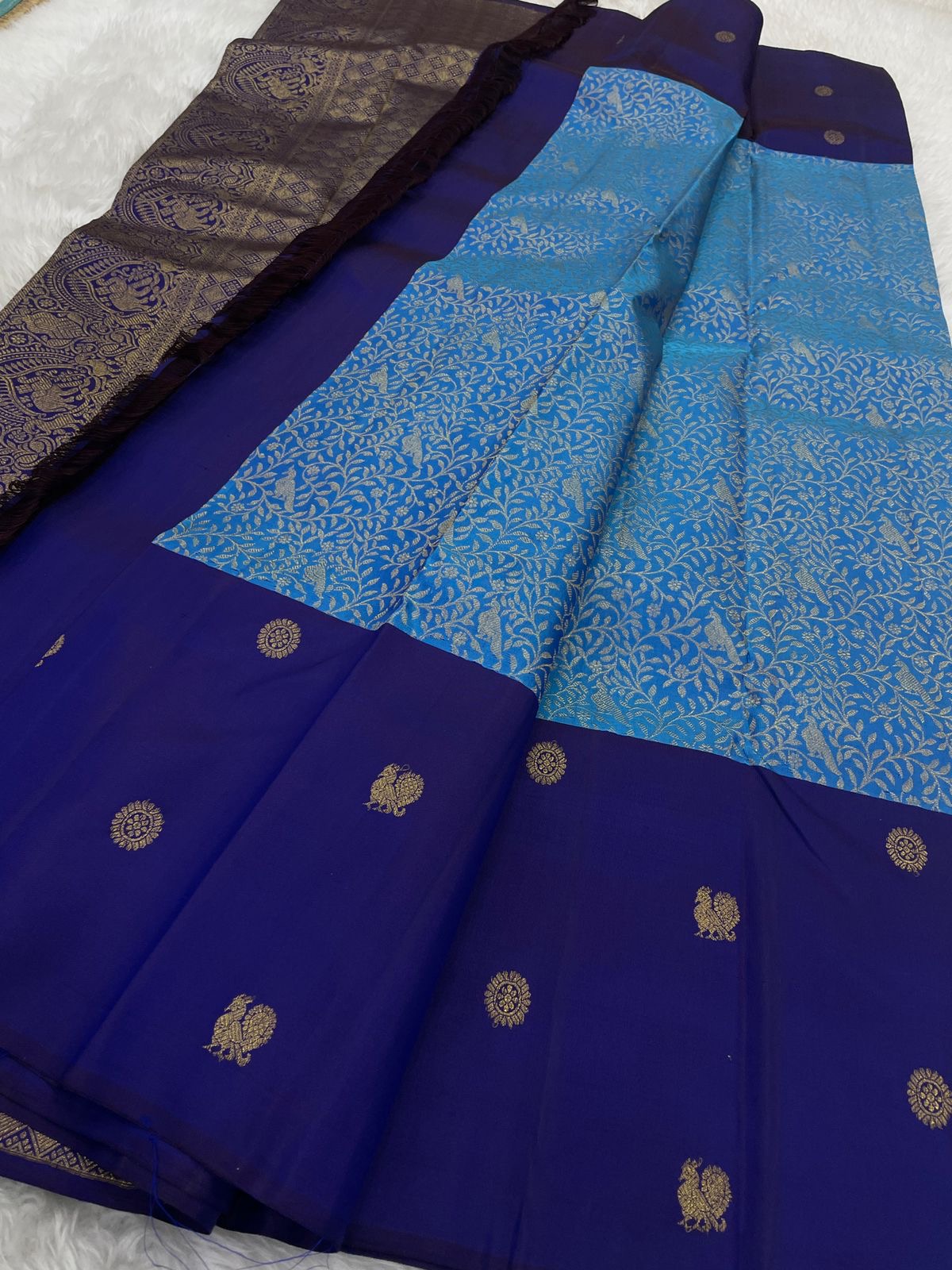 Cerulean Blue Kanchipuram silk with dense floral Kodi-Valli gold zari weaving