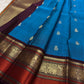 Cerulean Blue and Deep Plum Handwoven Pure Silk Kanjipuram Saree with Floral Butta and Varisaipet Border