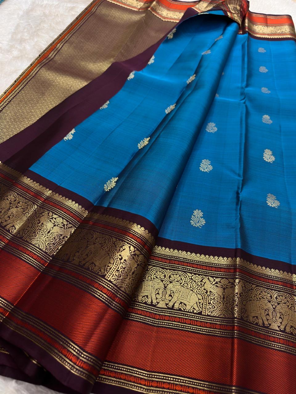 Cerulean Blue and Deep Plum Handwoven Pure Silk Kanjipuram Saree with Floral Butta and Varisaipet Border