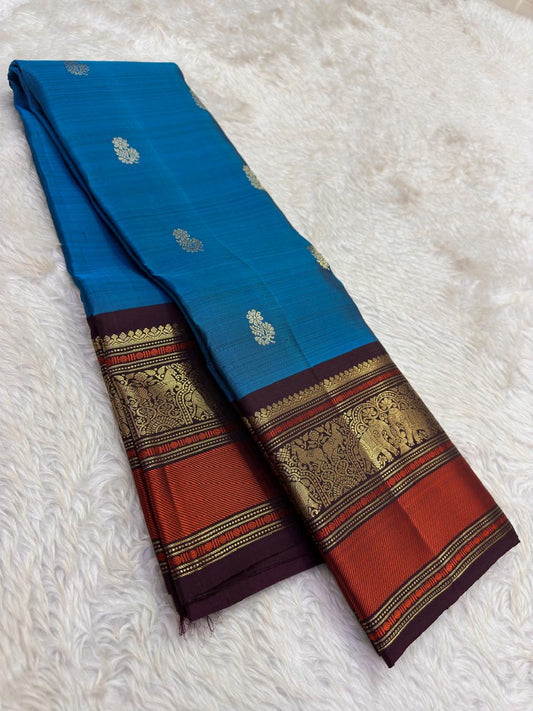 Cerulean Blue and Deep Plum Handwoven Pure Silk Kanjipuram Saree with Floral Butta and Varisaipet Border