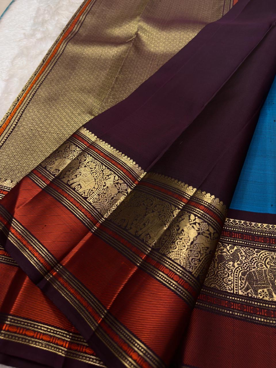 Cerulean Blue and Deep Plum Handwoven Pure Silk Kanjipuram Saree with Floral Butta and Varisaipet Border