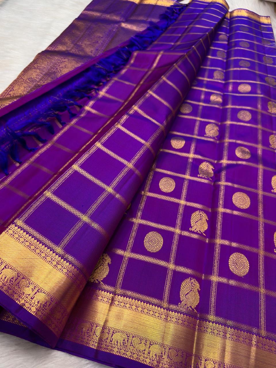 Chakram and Annam bird buttas inside the gold Zari Kattam on Kathiripoo Violet silk.