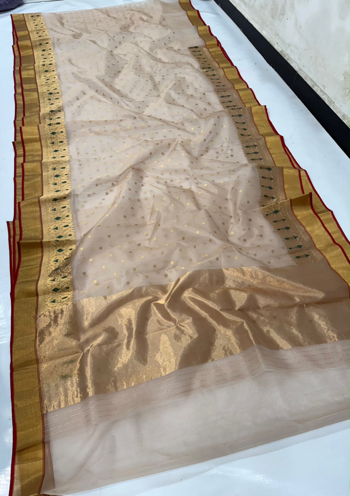 Handwoven beige silk Chanderi saree with gold detailing