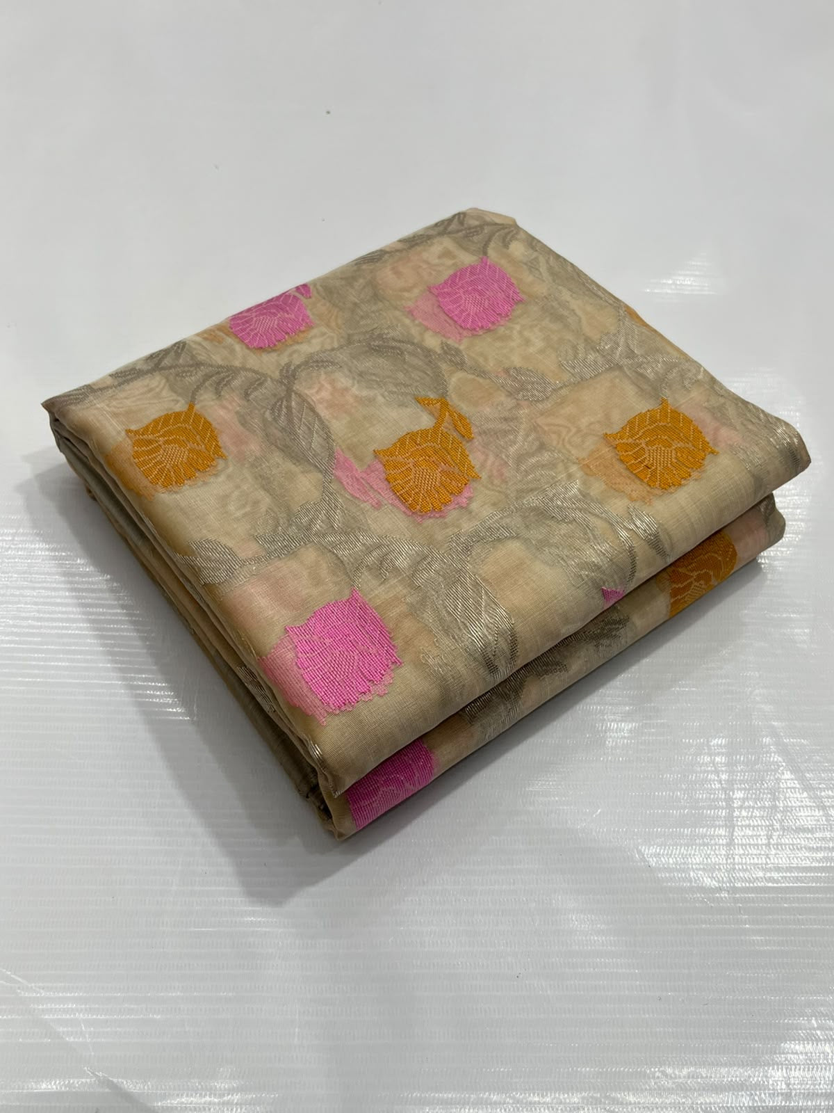 Champagne beige Katan Silk Chanderi saree with pink and marigold floral motifs