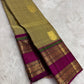 Champagne gold handwoven Pure Silk Kanjivaram saree with magenta border, full drape view.