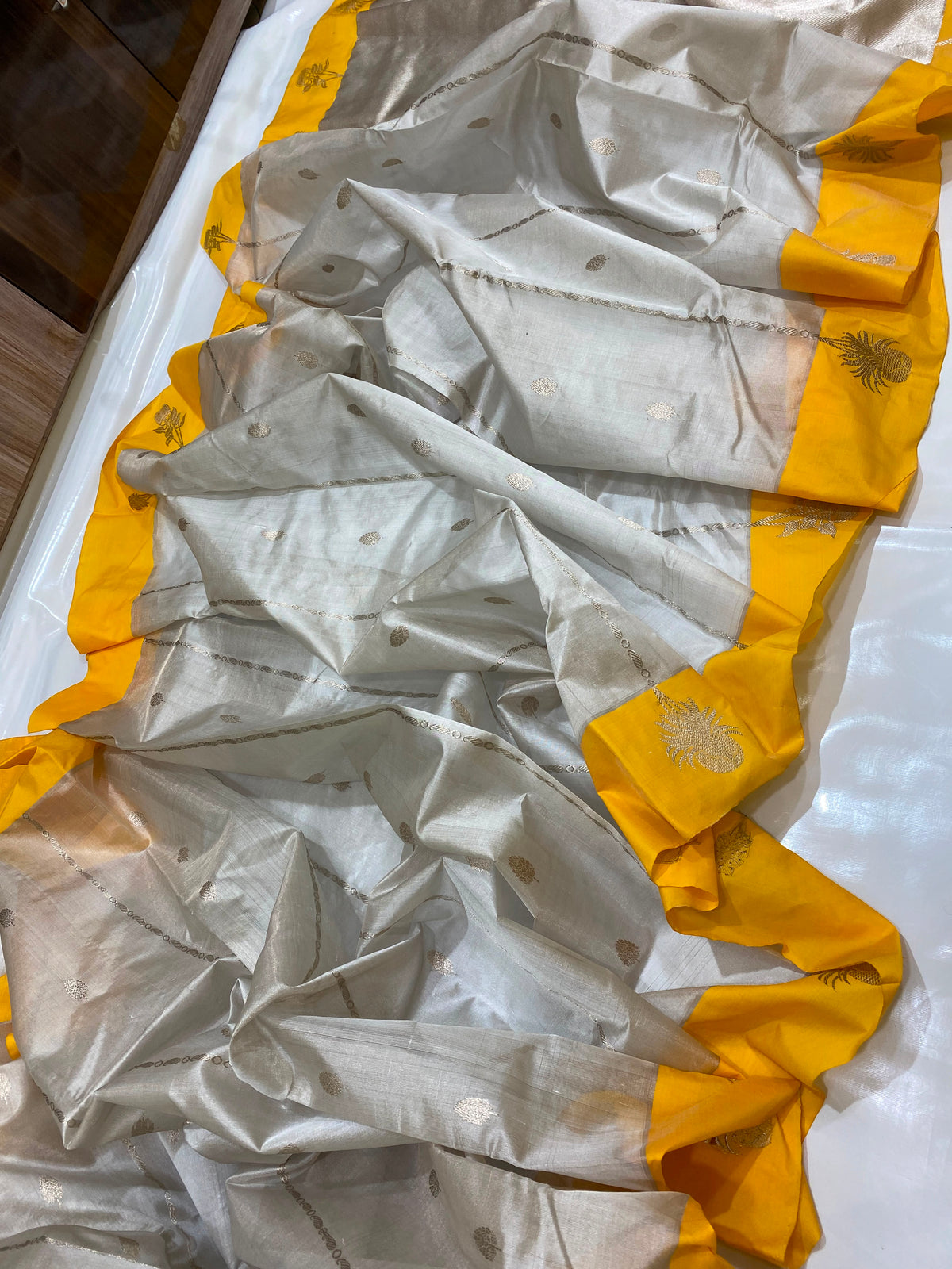 Mustard yellow botanical border on pale champagne gold Chanderi tissue silk