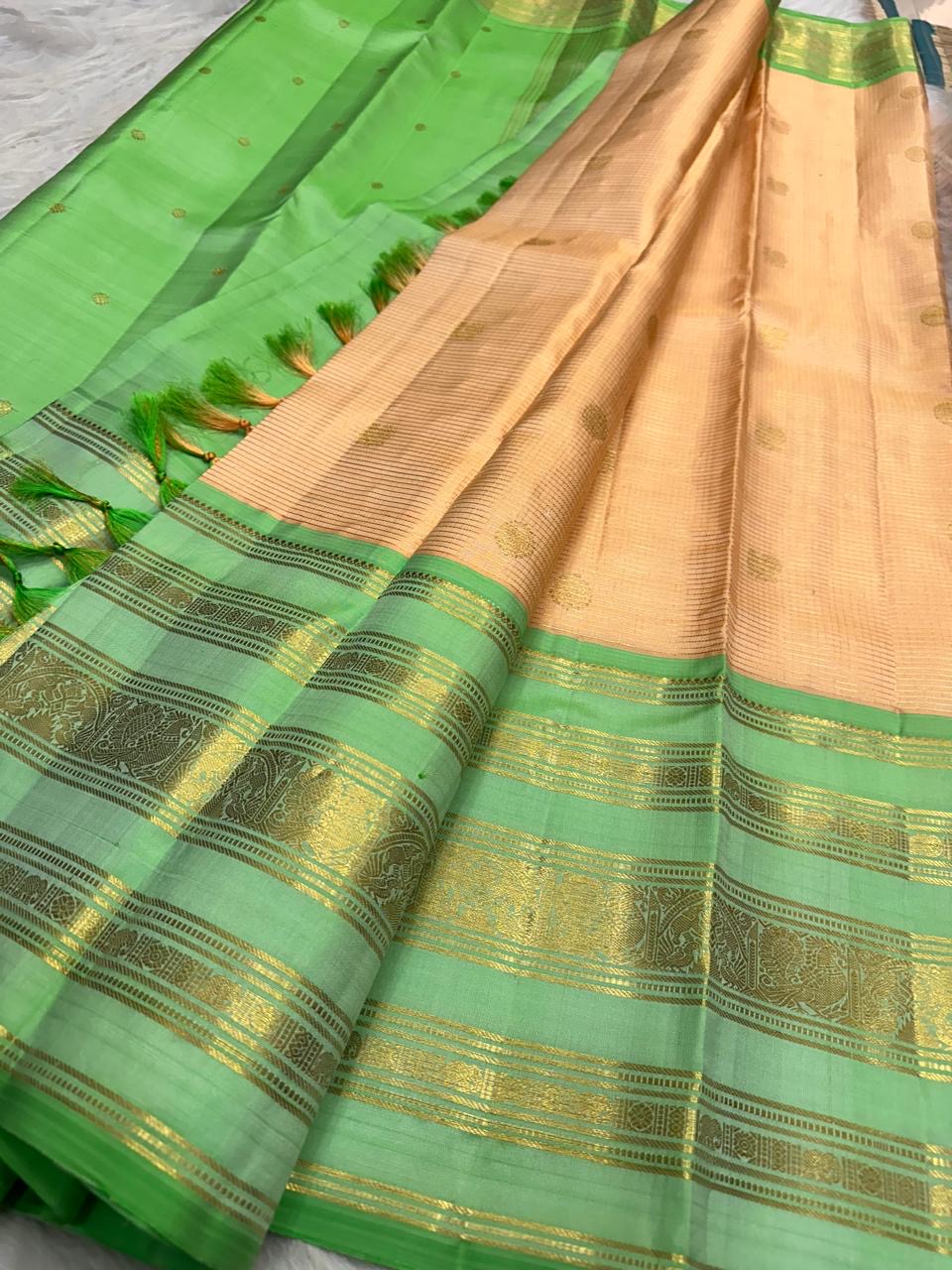 Champagne Peach Handwoven Pure Silk KanchiPattu Saree with Varisaipet Weave and Mint Green Zari Border