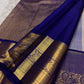 Warm sandalwood-ivory Kanchipuram silk body showing a fine classic-gold zari kattam and traditional buttas.