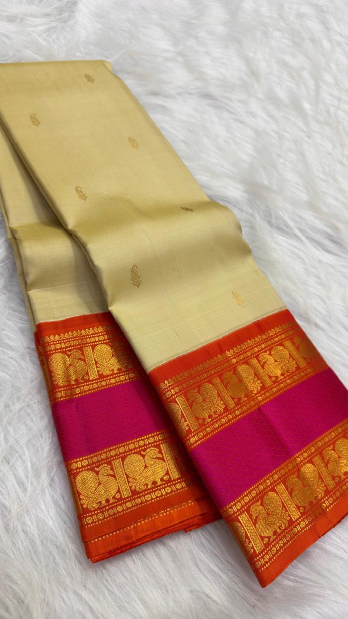 Chandanam sandalwood Pure Silk Kanchipuram Rettapet saree with sunset-orange and magenta-shot border.