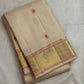 Alternate full view of the Chandanam pure silk Kanchipuram saree showing the soft body and woven pallu.