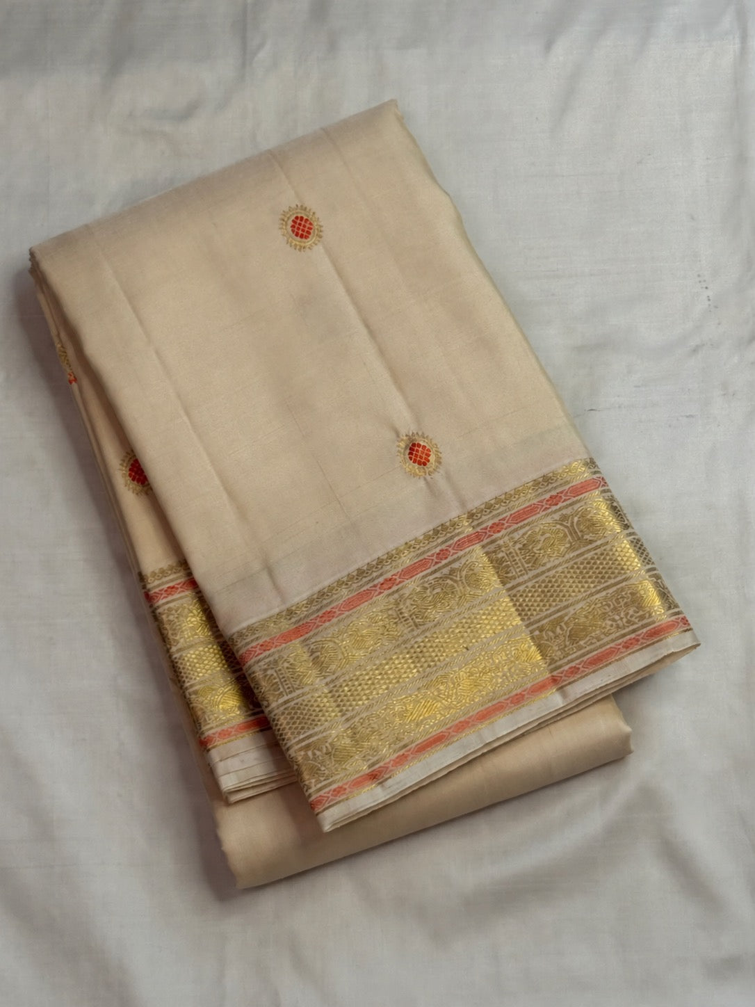 Alternate full view of the Chandanam pure silk Kanchipuram saree showing the soft body and woven pallu.