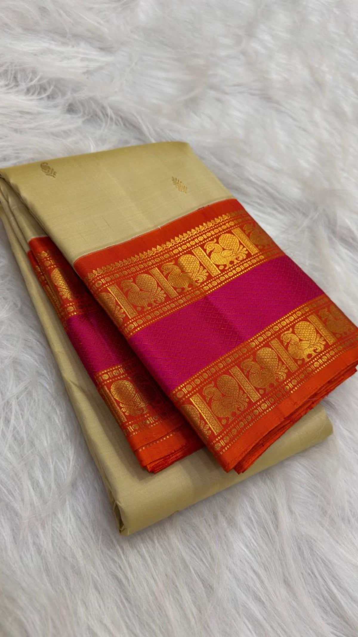 Rettapet Kanchipuram saree with layered orange, magenta and classic-gold zari border registers.