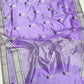 Lilac Pattu silk Chanderi saree showing the silky lavender body with white and grey floral butis