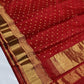 Gold zari border with geometric detailing on vermilion red Chanderi saree