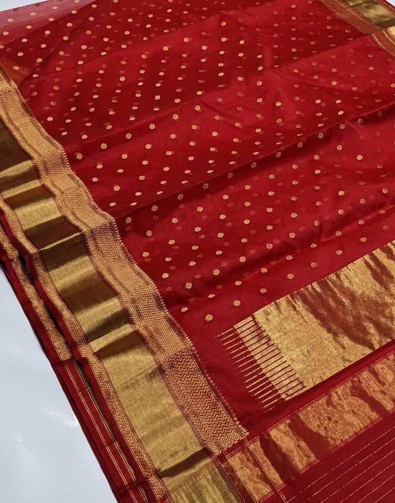Gold zari border with geometric detailing on vermilion red Chanderi saree
