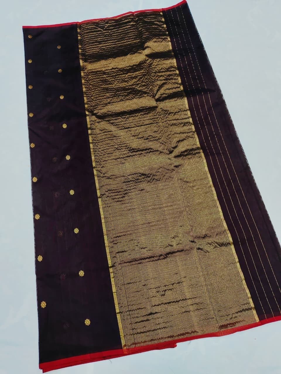 Gold zari border with red selvedge on deep aubergine Chanderi saree
