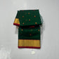 Emerald green Chanderi Pattu silk saree, red and gold floral butta detail