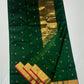 Gold zari border with red edge on emerald green Chanderi saree