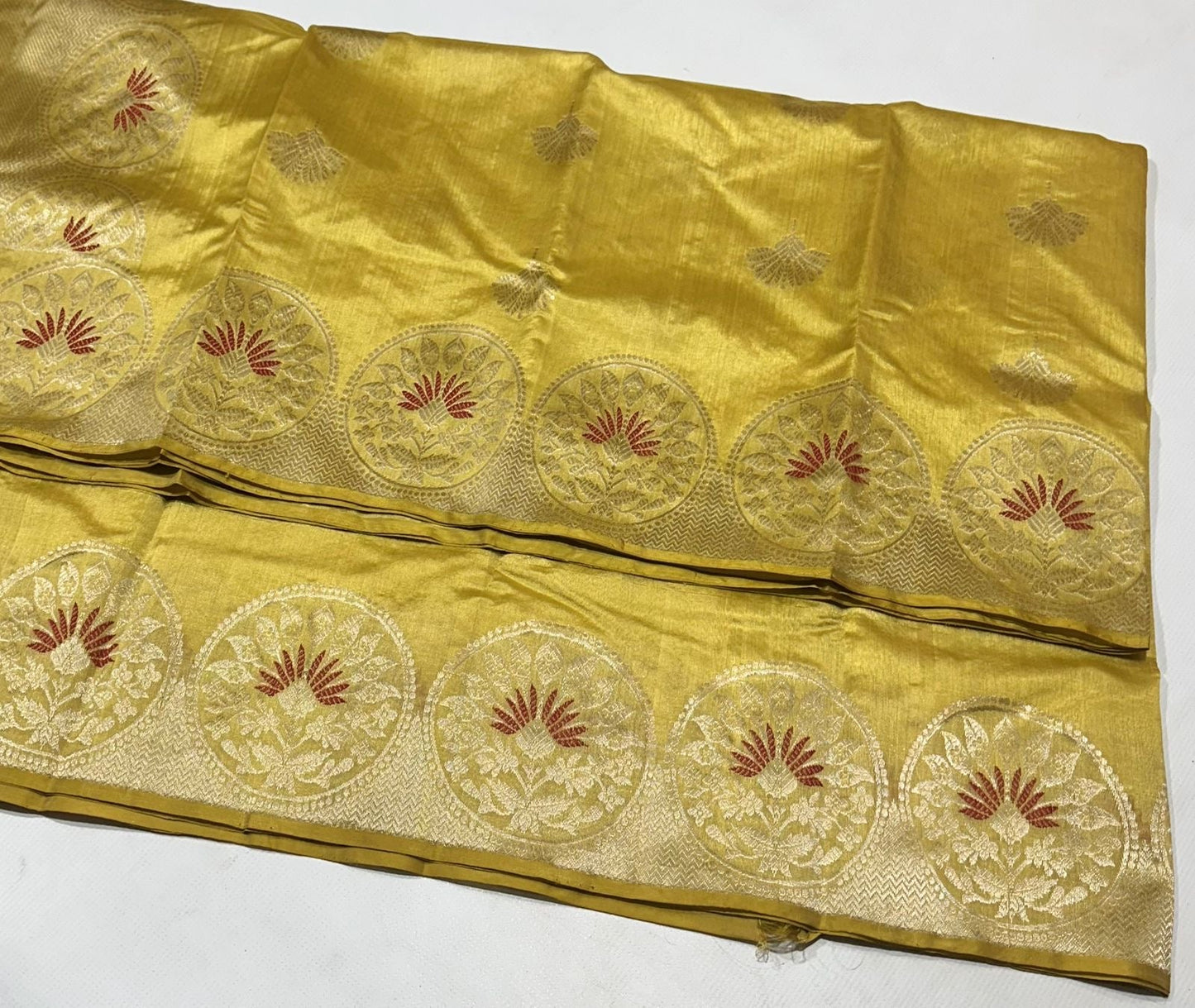 Golden yellow Chanderi Pattu silk saree, folded view