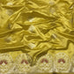 Golden yellow Chanderi Pattu silk saree, zari medallion border close-up